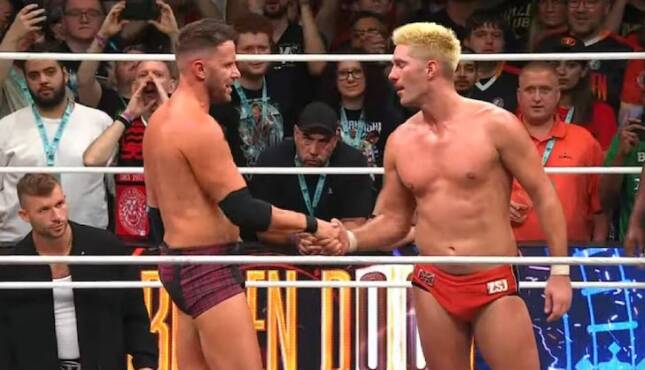 AEW x NJPW Forbidden Door Zack Sabre Jr and Nigel McGuinness shake hands, Johnny Saint