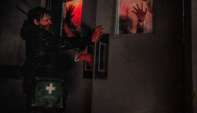 Resident Evil Austin Abrams runs away