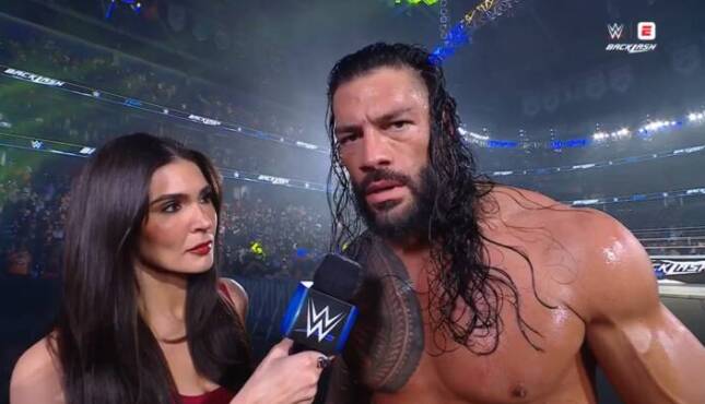 Cathy Kelley and Roman Reigns.